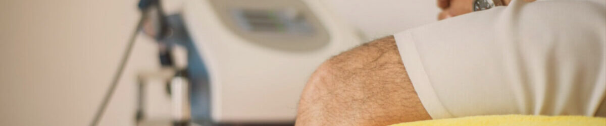 man with injured knee sitting in doctor's office with title "VA Disability for Knee Pain" overlaid